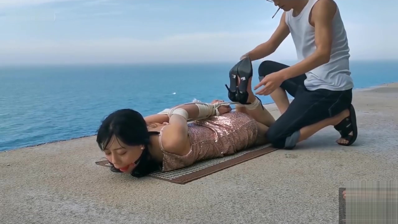 Chinese girl public bondage seaside
